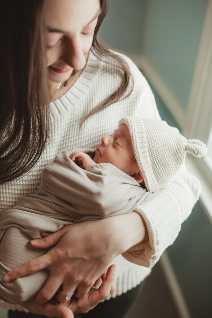 mom and swaddled baby boy