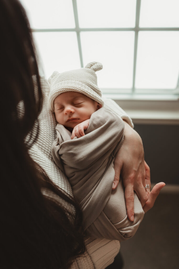 shot from above, baby in moms arms