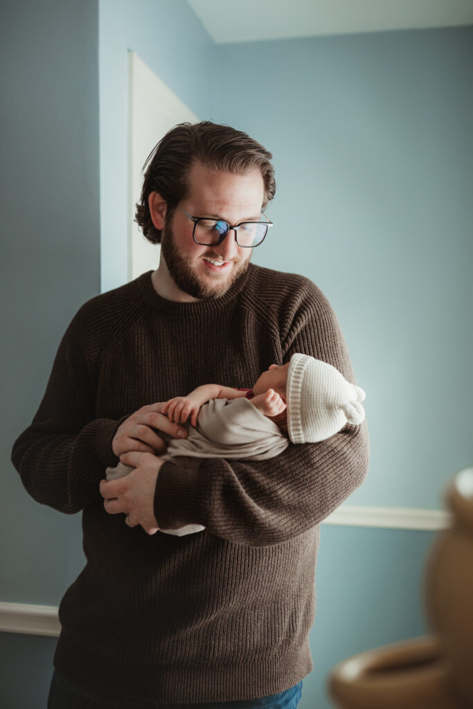 dad holding baby solo