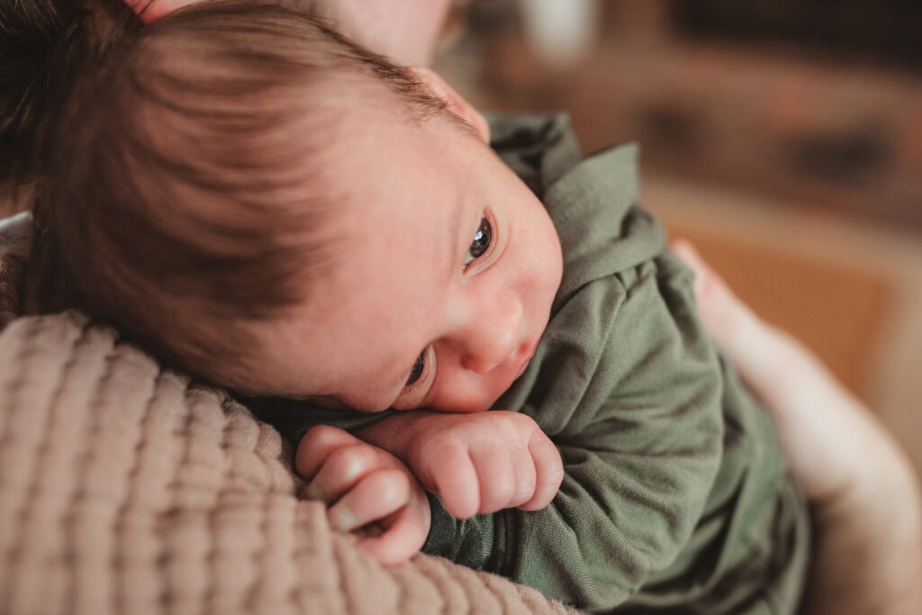 close up of baby on dads shoulder