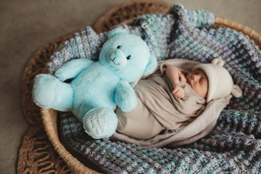 blue bear has inscription "Auntie Yvonne loves you" in memory of baby's late maternal aunt who passed away shortly before his birth. This is a meaningful keepsake.