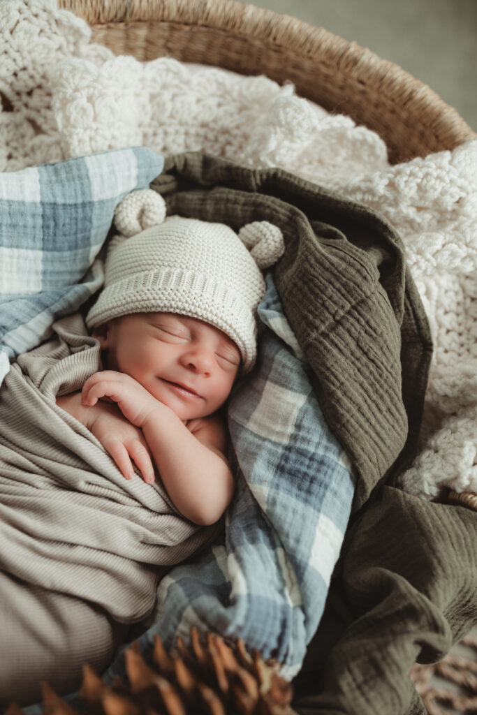 baby smiles in his sleep.