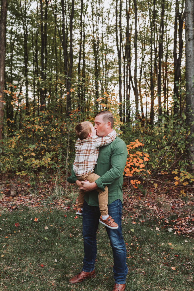 dad kissing his son