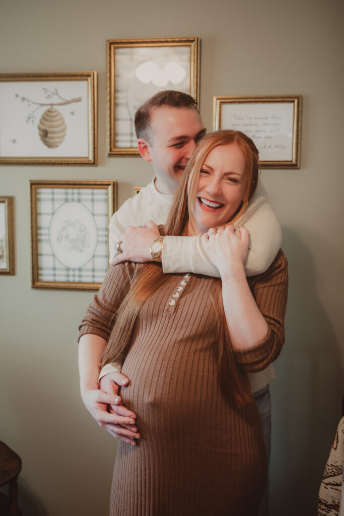 pregnant couple laughing together