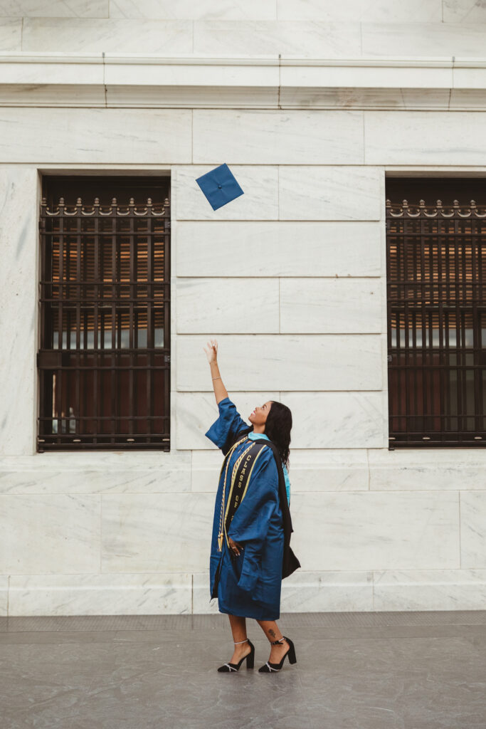 grad throws cap in the air